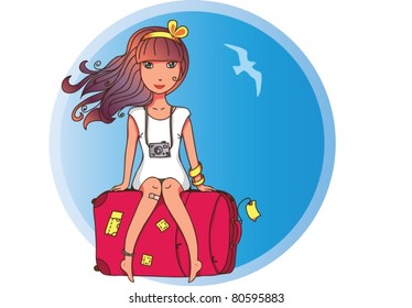 Nice girl sitting on a suitcase