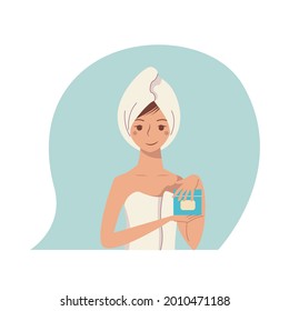 Nice girl in a towel made a hair mask. Self-care procedure.