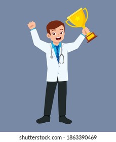 nice good looking young doctor standing and holding trophy