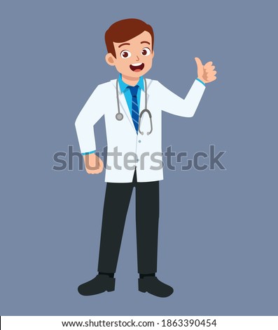 nice good looking young doctor standing and show thumb up
