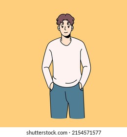 Nice guy with hands in pockets, happy smiling man