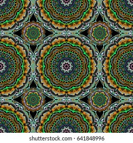 Nice hand-drawn seamless vector illustration. Elegant seamless pattern with doodles and Mandala elements.