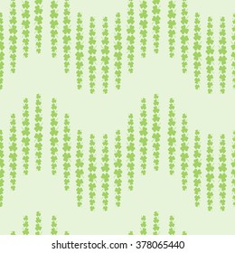 Nice pattern with clover leaves on green background