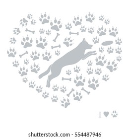 Nice picture of jumping dog silhouette on a background of dog tracks and bones in the form of heart on a white background.