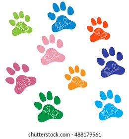 Nice picture of silhouette cats lying inside multicolored animal traces on a white background.