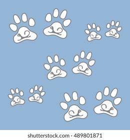 Nice picture of silhouette cats lying inside animal traces on a colored background in gentle tones.