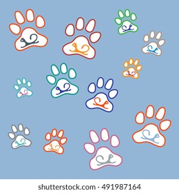 Nice picture of silhouette cats lying inside animal traces on a colored background in gentle tones.