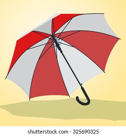 Nice red and white open striped umbrella on yellow.