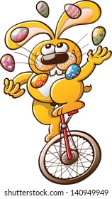 Nice and smiling yellow rabbit juggling decorated Easter eggs and keeping balance while riding an unicycle