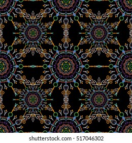 Nice yellow, blue and violet hand-drawn seamless vector illustration. Elegant seamless pattern with floral and Mandala elements.
