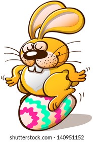 Nice yellow bunny seating on a beautifully decorated Easter egg
