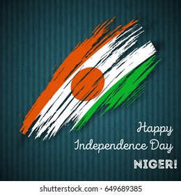 Niger Independence Day Patriotic Design. Expressive Brush Stroke in National Flag Colors on dark striped background. Happy Independence Day Niger Vector Greeting Card.