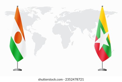 Niger and Myanmar flags for official meeting against background of world map.