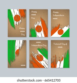 Niger Patriotic Cards for National Day. Expressive Brush Stroke in National Flag Colors on kraft paper background. Niger Patriotic Vector Greeting Card.