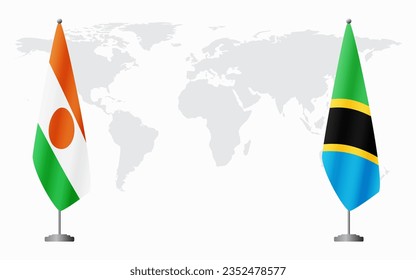 Niger and Tanzania flags for official meeting against background of world map.