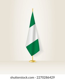 Nigeria flag on a flag stand. Vector illustration.