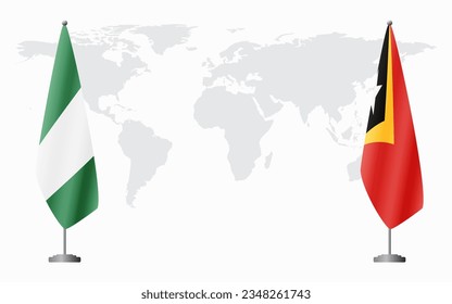 Nigerian and East Timor flags for official meeting against background of world map.