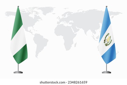 Nigerian and Guatemala flags for official meeting against background of world map.