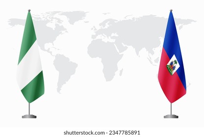 Nigerian and Haiti flags for official meeting against background of world map.