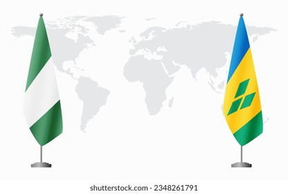 Nigerian and Saint Vincent and the Grenadines flags for official meeting against background of world map.