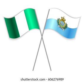 Nigerian and Sammarinese crossed flags. Nigeria combined with San Marino isolated on white. Language learning, international business or travel concept.