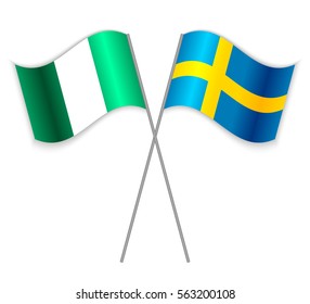 Nigerian and Swedish crossed flags. Nigeria combined with Sweden isolated on white. Language learning, international business or travel concept.