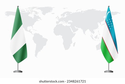 Nigerian and Uzbekistan flags for official meeting against background of world map.