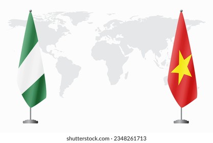 Nigerian and Vietnam flags for official meeting against background of world map.