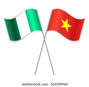 Nigerian and Vietnamese crossed flags. Nigeria combined with Vietnam isolated on white. Language learning, international business or travel concept.