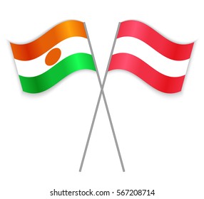 Nigerien and Austrian crossed flags. Niger combined with Austria isolated on white. Language learning, international business or travel concept.