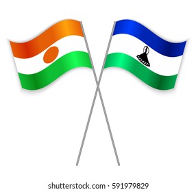 Nigerien and Basotho crossed flags. Niger combined with Lesotho isolated on white. Language learning, international business or travel concept.