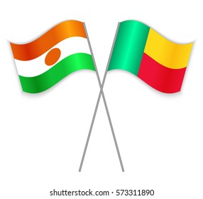 Nigerien and Beninese crossed flags. Niger combined with Benin isolated on white. Language learning, international business or travel concept.