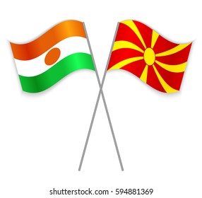 Nigerien and Macedonian crossed flags. Niger combined with Macedonia isolated on white. Language learning, international business or travel concept.