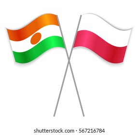 Nigerien and Polish crossed flags. Niger combined with Poland isolated on white. Language learning, international business or travel concept.