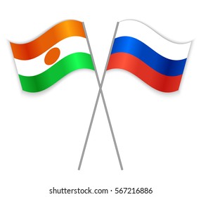 Nigerien and Russian crossed flags. Niger combined with Russia isolated on white. Language learning, international business or travel concept.