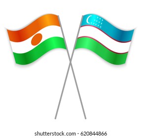 Nigerien and Uzbek crossed flags. Niger combined with Uzbekistan isolated on white. Language learning, international business or travel concept.