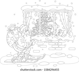 The night before Christmas, a little boy looking through a window at Santa Claus skiing with his big bag of holiday gifts, black and white vector cartoon illustration