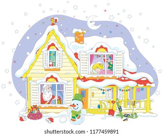 The night before Christmas, Santa Claus with his gifts for a little girl in a snow-covered house