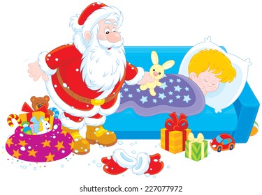 The night before Christmas, Santa Claus with his gifts by the bed of a sleeping boy