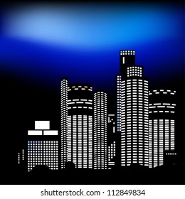 Night city. Modern buildings, the light in the windows.