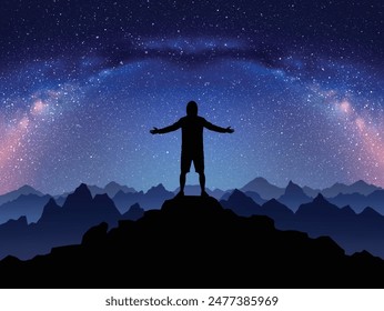 Night climbing. Man with outstretched arms on top of rocky mountain