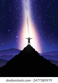 Night climbing. Man with outstretched arms on top of rocky mountain