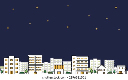 Night sky with copy space and a cityscape background of houses, apartments, stores, and buildings