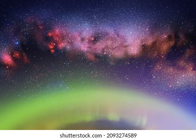 Night starry sky. Milky Way and Northern lights. Green aurora borealis