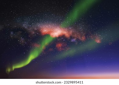 Night starry sky. Milky Way and Northern lights. Green aurora borealis