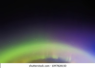 Night starry sky. Northern lights. Dark blue green aurora borealis