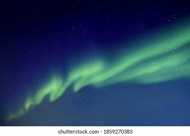 Night starry sky and Northern lights. Green aurora borealis