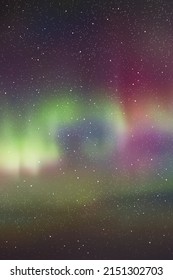 Night starry sky and Northern lights. Purple green aurora borealis