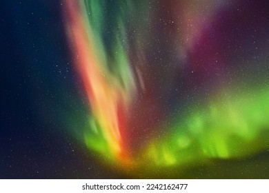 Night starry sky and Northern lights. Green aurora borealis