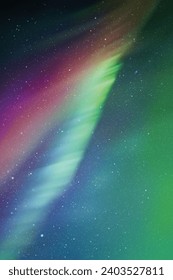Night starry sky and Northern lights. Red-green aurora borealis